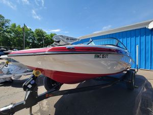 2016 Yamaha Boats SX192 on trailer, red and white, parked outdoors under clear sky.