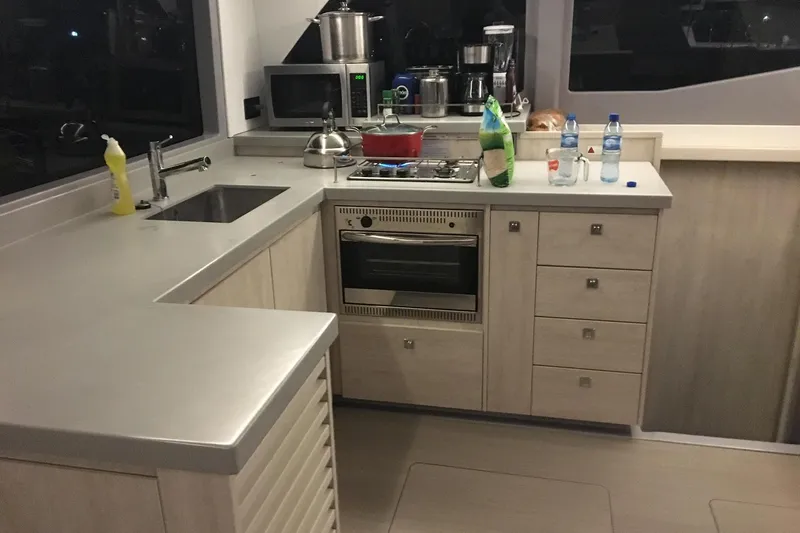 Nice Aft Too Yacht Photos Pics Modern kitchen in a 2018 Leopard 45 yacht with appliances and sleek countertops.