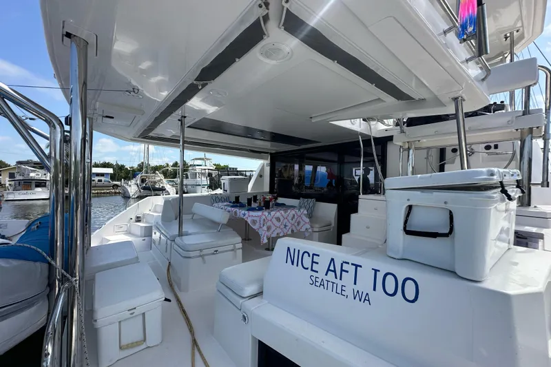Nice Aft Too Yacht Photos Pics Leopard 45 yacht, 2018 model, docked with outdoor seating and table setup.