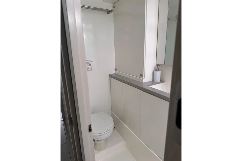 Nice Aft Too Yacht Photos Pics Compact bathroom in a 2018 Leopard 45 yacht, featuring modern fixtures and sleek design.