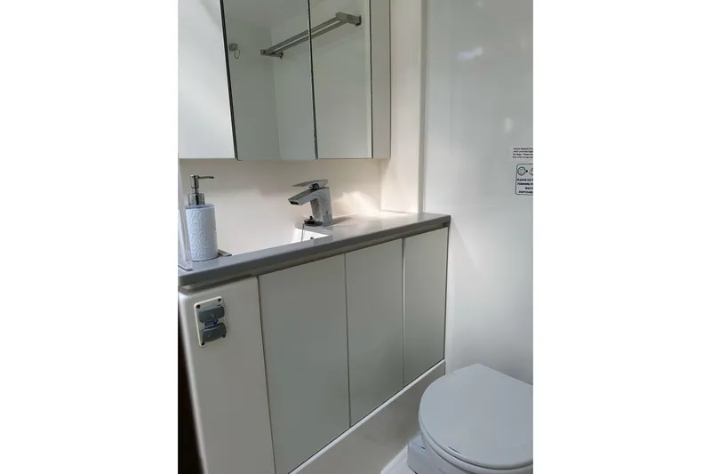 Nice Aft Too Yacht Photos Pics Modern bathroom in 2018 Leopard 45 yacht with sleek fixtures and mirrored cabinet.