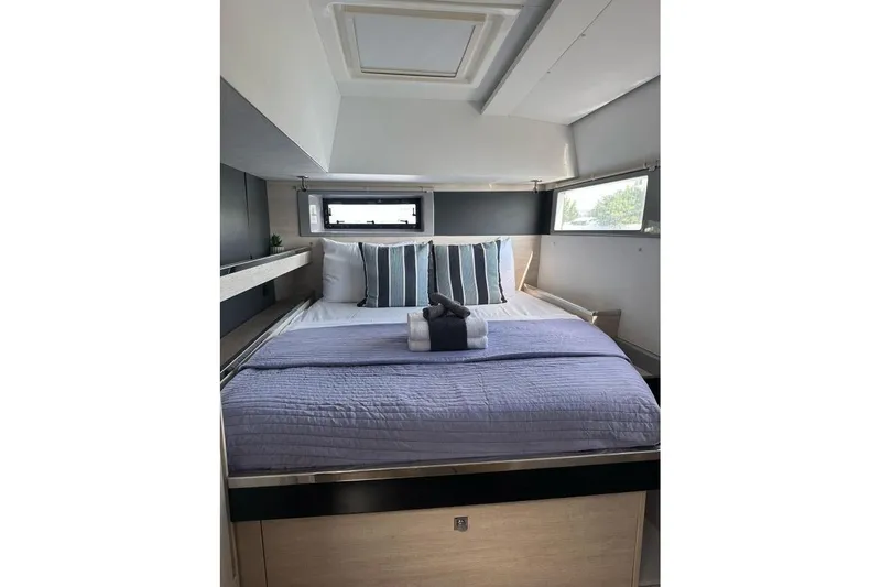 Nice Aft Too Yacht Photos Pics Luxurious bedroom interior of 2018 Leopard 45 yacht with modern bedding and natural light.