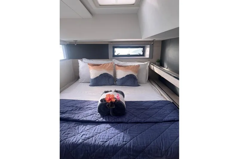 Nice Aft Too Yacht Photos Pics Luxurious bedroom interior of 2018 Leopard 45 yacht with elegant bedding and decor.