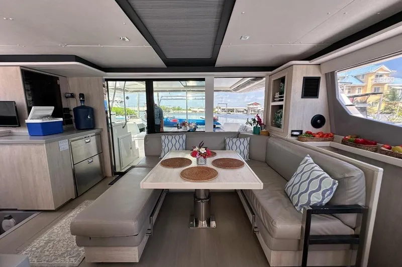 Nice Aft Too Yacht Photos Pics Luxurious 2018 Leopard 45 yacht interior with dining area and modern kitchen amenities.