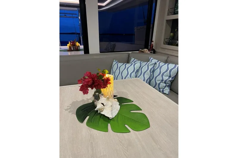 Nice Aft Too Yacht Photos Pics Cozy Leopard 45 yacht interior with floral centerpiece and decorative pillows, 2018 model.