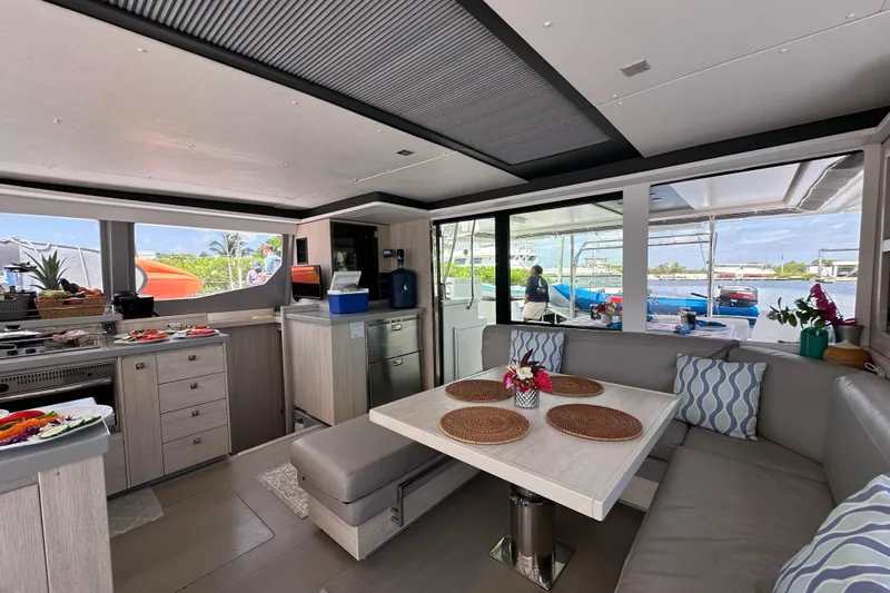 Nice Aft Too Yacht Photos Pics Luxurious interior of a 2018 Leopard 45 catamaran with modern kitchen and dining area.