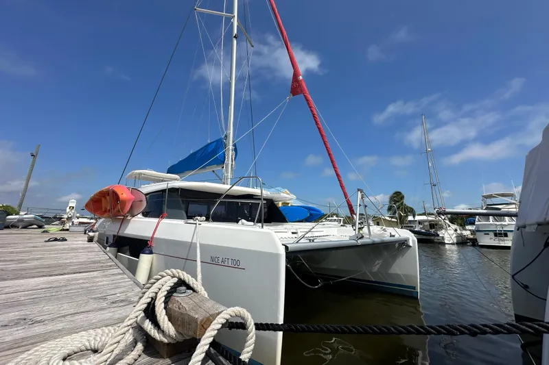 Nice Aft Too Yacht Photos Pics 2018 Leopard 45 catamaran docked at marina under clear blue sky.