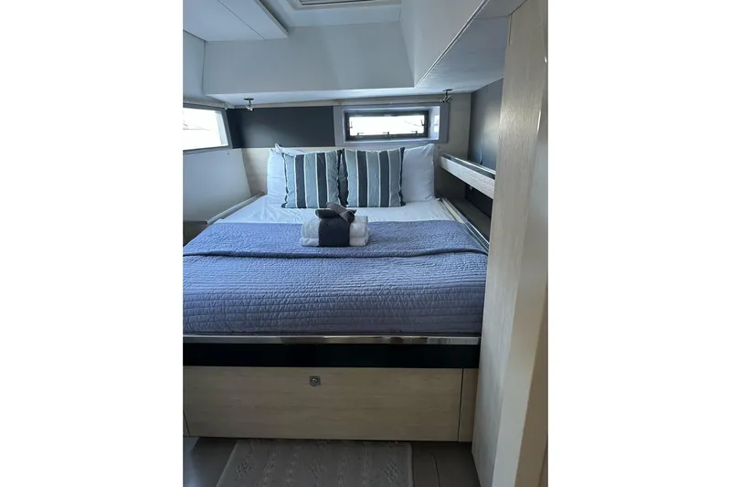 Nice Aft Too Yacht Photos Pics Luxurious cabin interior of 2018 Leopard 45 yacht with cozy bedding and modern design.