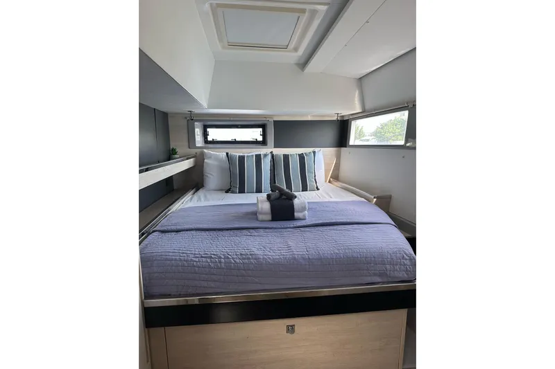 Nice Aft Too Yacht Photos Pics Luxurious bedroom interior of 2018 Leopard 45 yacht with modern bedding and natural light.
