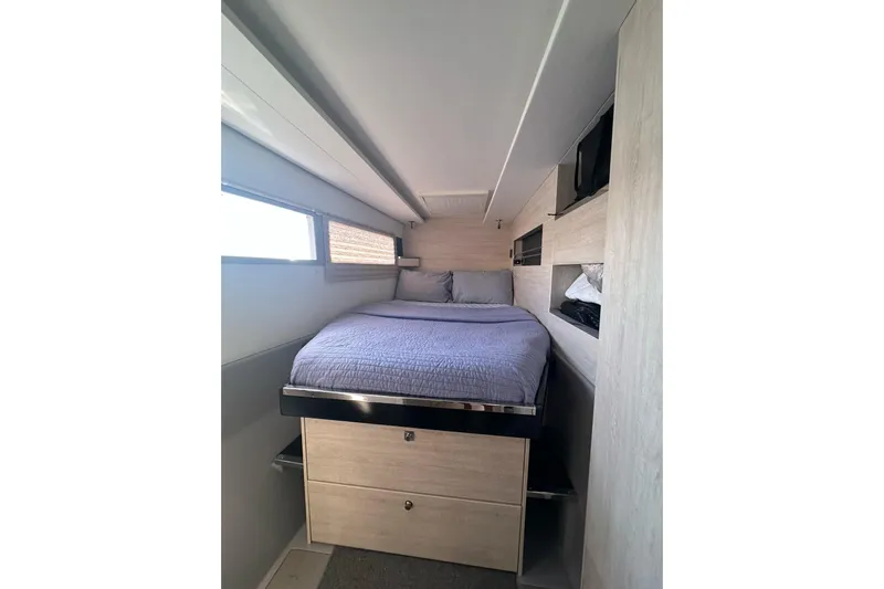 Nice Aft Too Yacht Photos Pics Cozy bedroom interior of 2018 Leopard 45 yacht with modern design and storage.