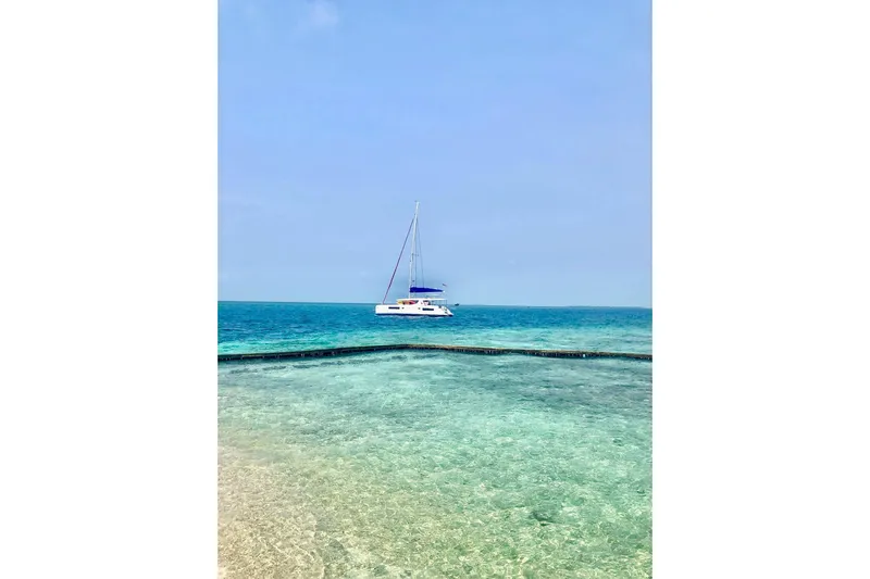 Nice Aft Too Yacht Photos Pics Sailing catamaran Leopard 45 on clear turquoise ocean, 2018 model.