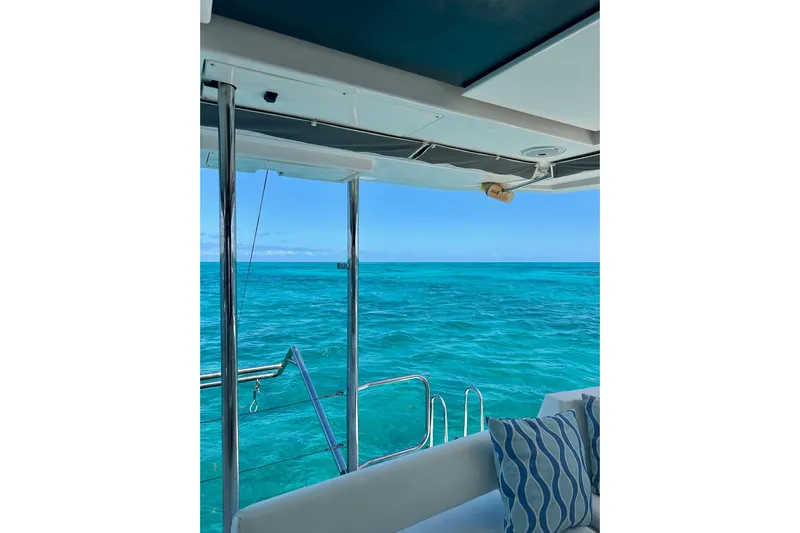 Nice Aft Too Yacht Photos Pics View from a 2018 Leopard 45 yacht overlooking turquoise ocean waters.