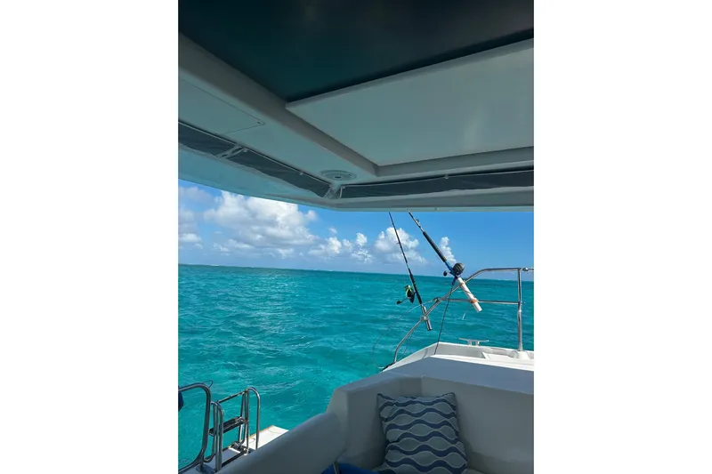 Nice Aft Too Yacht Photos Pics Leopard 45 yacht with fishing rods, ocean view, and blue sky, 2018 model.