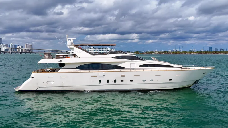  Yacht Photos Pics 2006 Azimut 100 Jumbo yacht cruising on a calm sea under a cloudy sky.