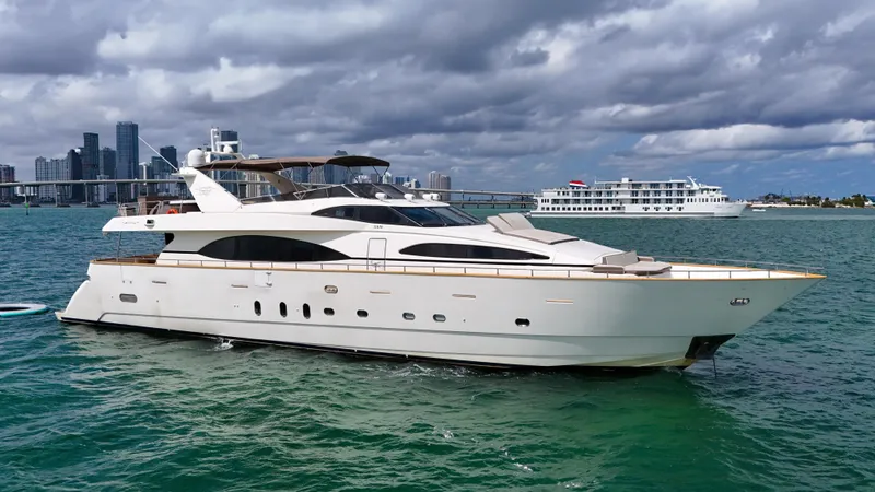  Yacht Photos Pics 2006 Azimut 100 Jumbo luxury yacht cruising in a scenic coastal city.