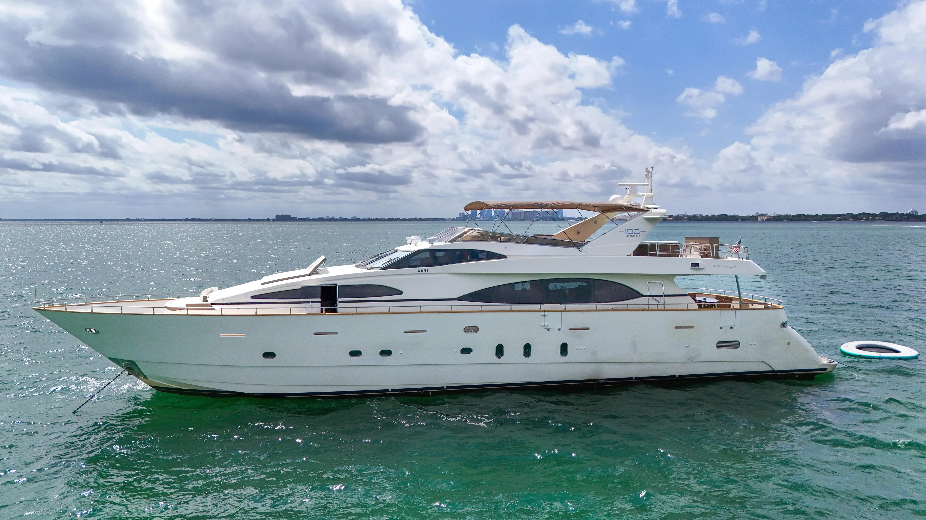  Yacht Photos Pics 2006 Azimut 100 Jumbo yacht on open water under a partly cloudy sky.