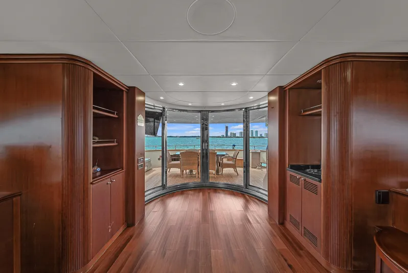  Yacht Photos Pics Luxurious interior of 2006 Azimut 100 Jumbo yacht with panoramic windows and wooden finishes.