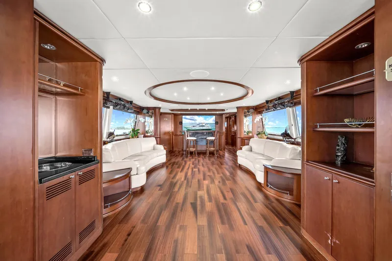  Yacht Photos Pics Luxurious interior of 2006 Azimut 100 Jumbo yacht with elegant wood flooring and white sofas.