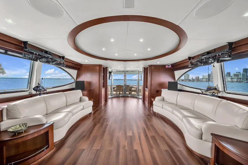  Yacht Photos Pics Luxurious interior of 2006 Azimut 100 Jumbo yacht with panoramic windows and elegant seating.