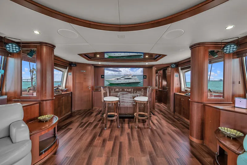  Yacht Photos Pics Luxurious interior of 2006 Azimut 100 Jumbo yacht with wooden flooring and elegant furnishings.