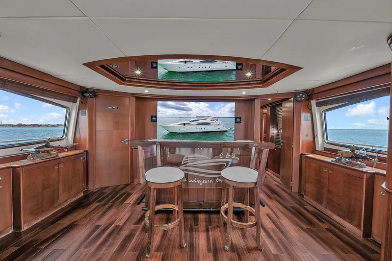  Yacht Photos Pics Luxurious interior of 2006 Azimut 100 Jumbo yacht with wooden flooring and panoramic windows.