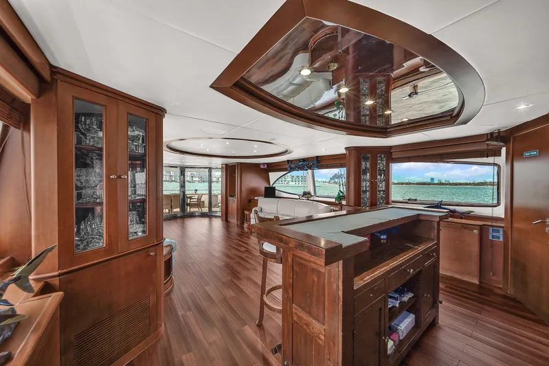  Yacht Photos Pics Luxurious interior of 2006 Azimut 100 Jumbo yacht with wooden furnishings and panoramic windows.