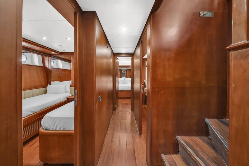  Yacht Photos Pics Interior hallway of 2006 Azimut 100 Jumbo yacht with wooden finishes and cabin access.