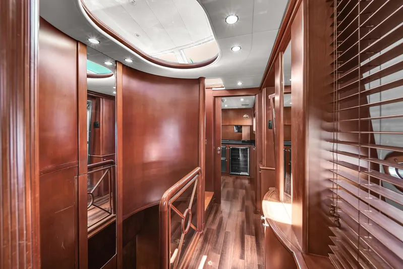  Yacht Photos Pics Luxurious interior of 2006 Azimut 100 Jumbo yacht with wooden finishes and modern lighting.