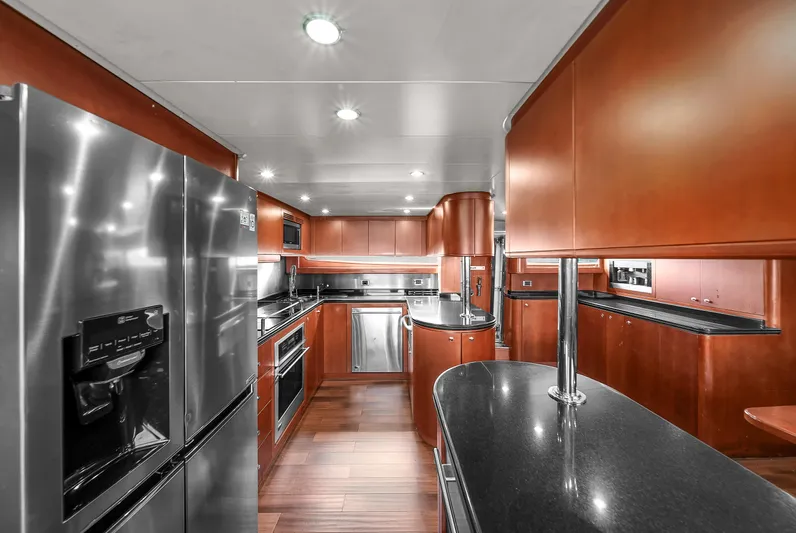  Yacht Photos Pics Luxurious kitchen interior of 2006 Azimut 100 Jumbo yacht with modern appliances.