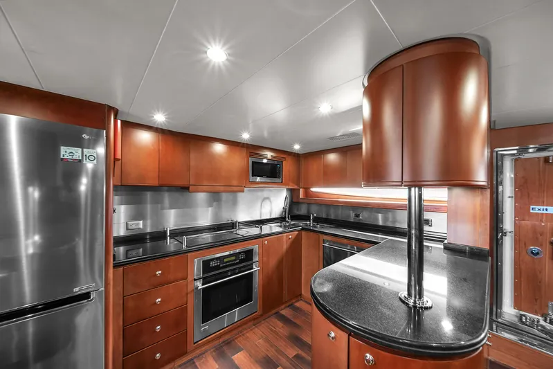  Yacht Photos Pics Luxurious kitchen in 2006 Azimut 100 Jumbo yacht with modern appliances and sleek design.