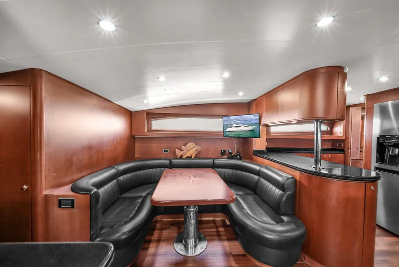  Yacht Photos Pics Luxurious interior of 2006 Azimut 100 Jumbo yacht with leather seating and modern amenities.