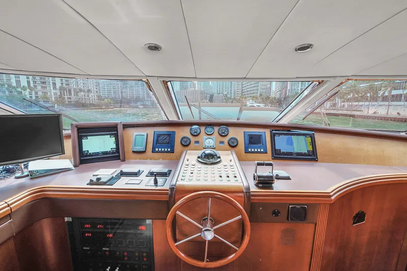  Yacht Photos Pics Helm of 2006 Azimut 100 Jumbo yacht with navigation instruments and steering wheel.