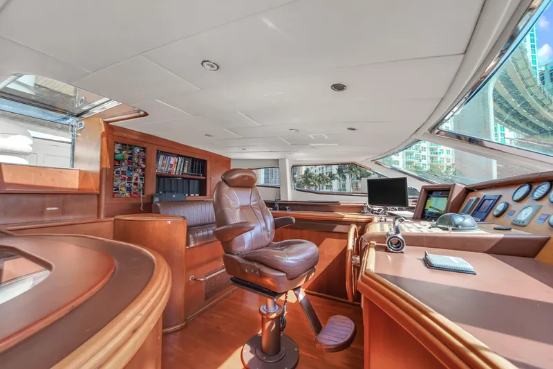  Yacht Photos Pics Luxurious helm station of 2006 Azimut 100 Jumbo yacht with leather captain's chair and navigation equipment.