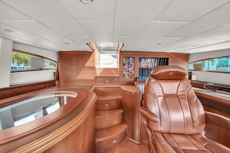  Yacht Photos Pics Luxurious interior of 2006 Azimut 100 Jumbo yacht with leather seating and wooden finishes.