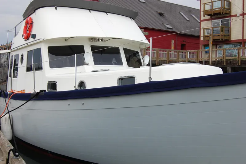  Yacht Photos Pics 1981 Willard Marine Pilot House Trawler docked at a marina.