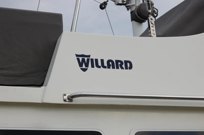  Yacht Photos Pics 1981 Willard Marine Pilot House Trawler with logo and railing detail.