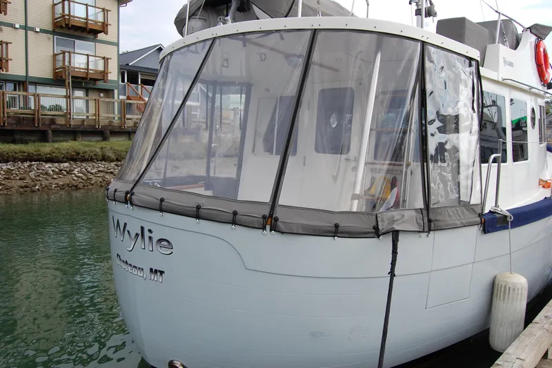  Yacht Photos Pics 1981 Willard Marine Pilot House Trawler docked near waterfront buildings.