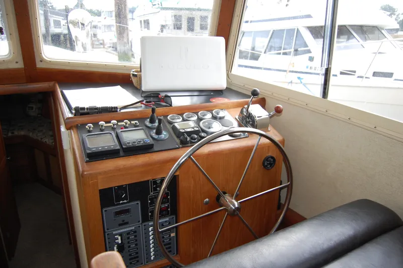 Yacht Photos Pics 1981 Willard Marine Pilot House Trawler helm with steering wheel and navigation controls.
