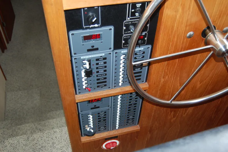  Yacht Photos Pics 1981 Willard Marine Pilot House Trawler control panel with steering wheel and electrical switches.