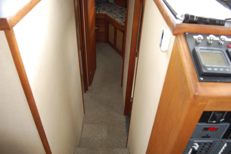  Yacht Photos Pics Interior of 1981 Willard Marine Pilot House Trawler, featuring hallway and control panel.