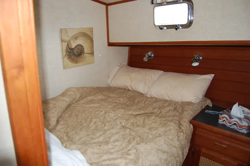  Yacht Photos Pics Cozy cabin bedroom in 1981 Willard Marine Pilot House Trawler with nautical decor.