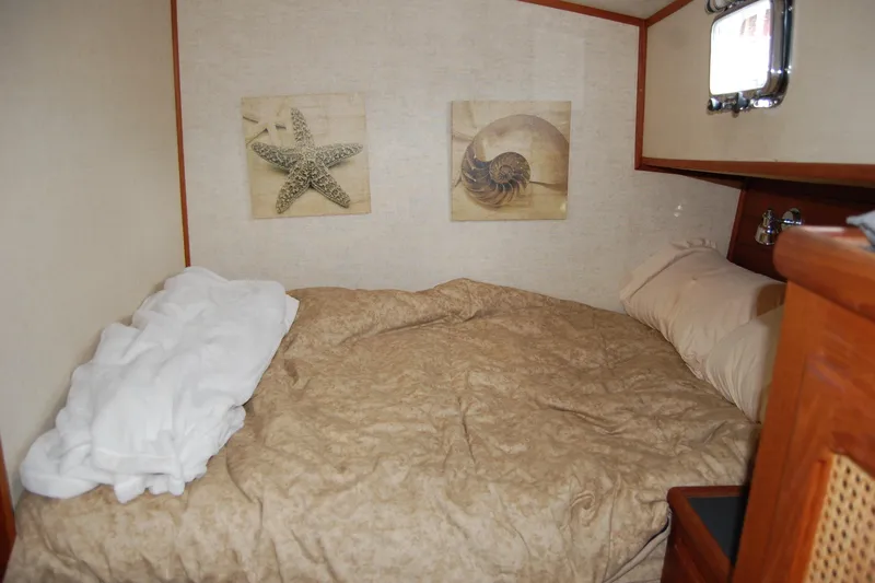  Yacht Photos Pics Cozy cabin interior of 1981 Willard Marine Pilot House Trawler with nautical decor.