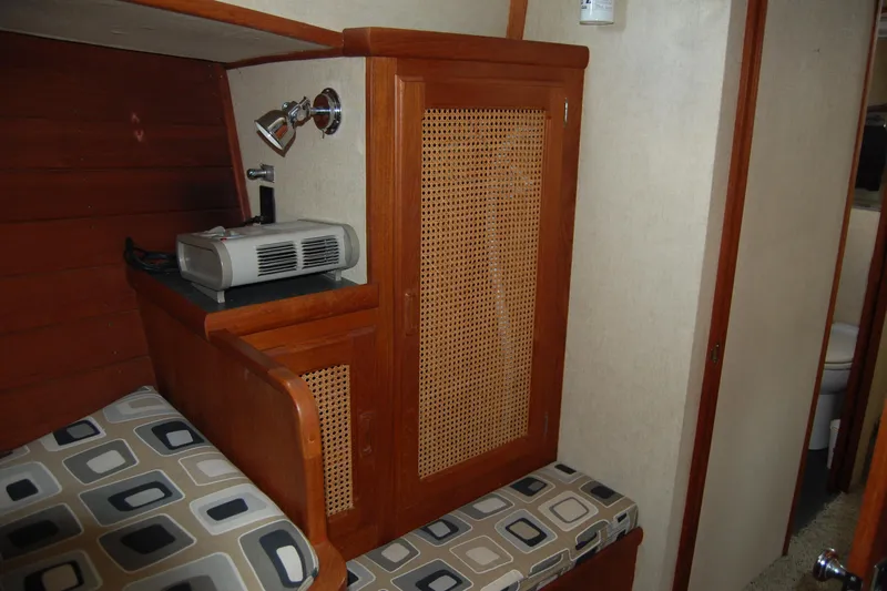 Yacht Photos Pics 1981 Willard Marine Pilot House Trawler interior with wood paneling and patterned cushions.