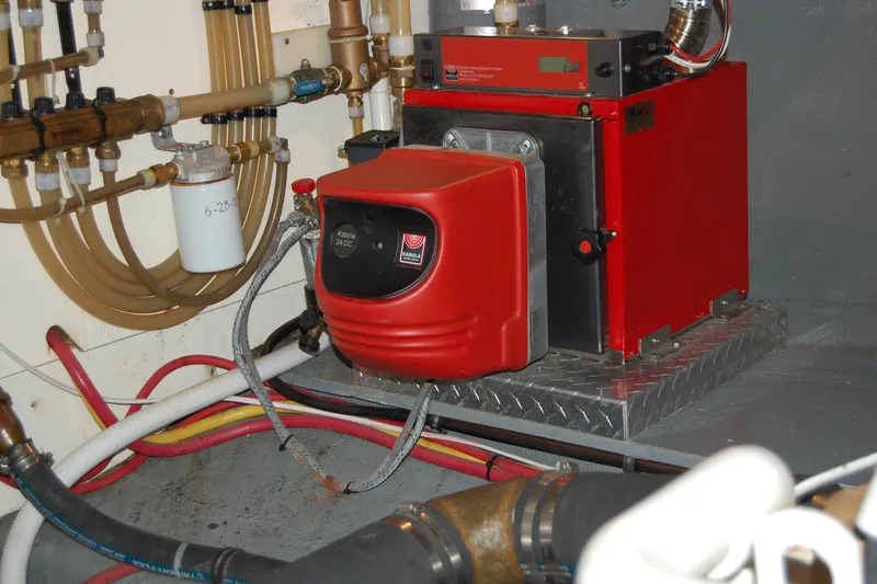  Yacht Photos Pics Engine room of 1981 Willard Marine Pilot House Trawler with red heating unit.