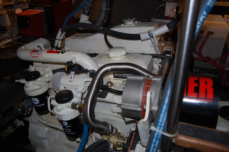  Yacht Photos Pics Engine room of a 1981 Willard Marine Pilot House Trawler, showcasing mechanical components.