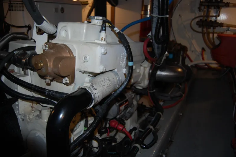  Yacht Photos Pics Engine room of 1981 Willard Marine Pilot House Trawler with visible machinery and wiring.