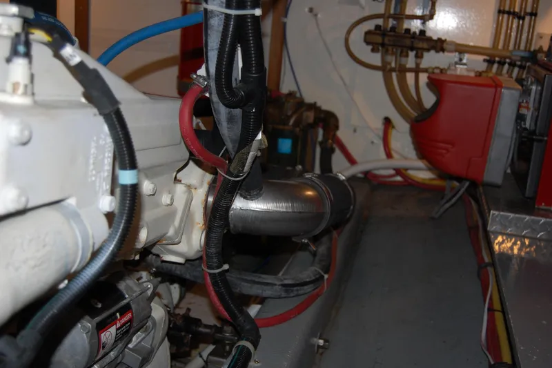  Yacht Photos Pics Engine room of 1981 Willard Marine Pilot House Trawler with visible pipes and machinery.