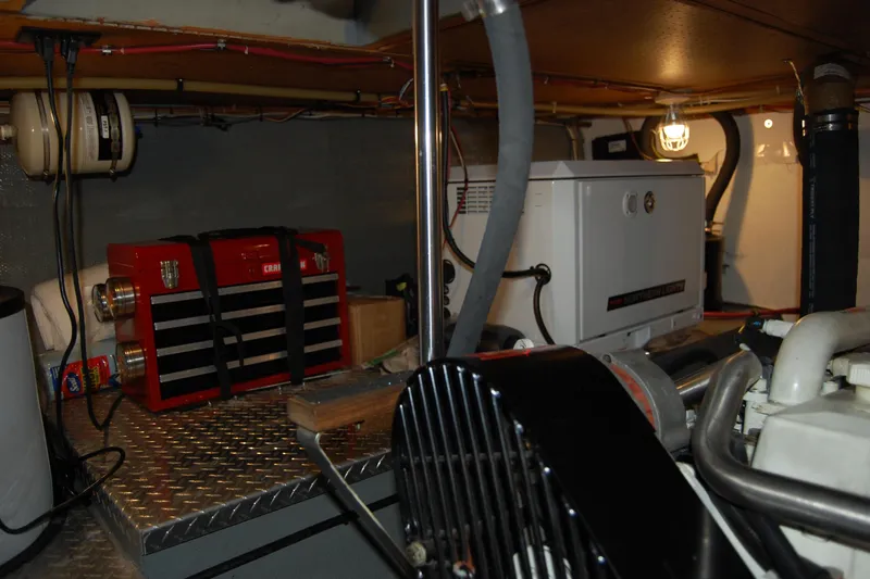  Yacht Photos Pics Engine room of 1981 Willard Marine Pilot House Trawler with tools and equipment.