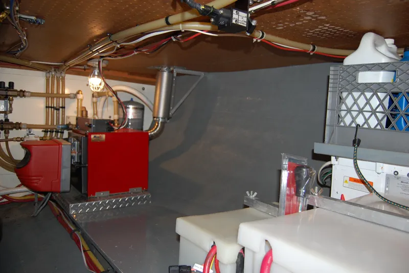  Yacht Photos Pics Engine room of 1981 Willard Marine Pilot House Trawler with equipment and wiring.