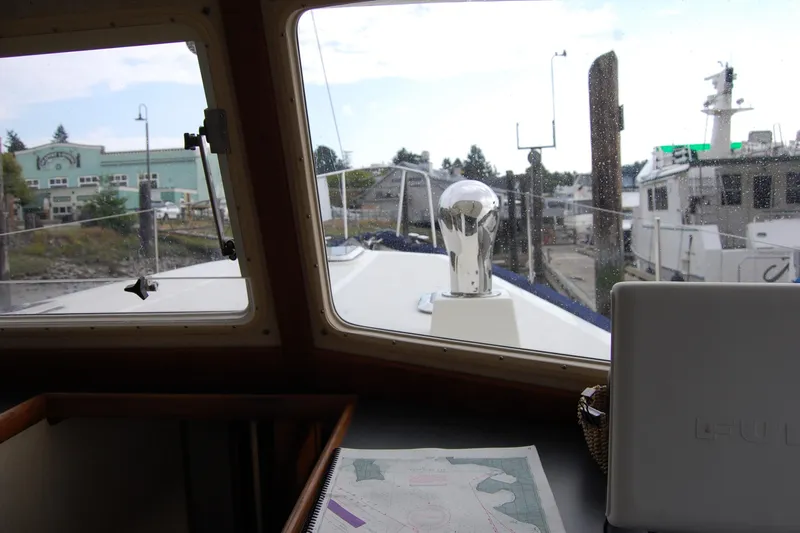  Yacht Photos Pics Interior view from 1981 Willard Marine Pilot House Trawler, showing navigation map and marina.